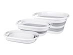 Three collapsible laundry baskets in different sizes and states of collapse