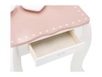 Pink and white vanity table with an open drawer, decorated with white hearts