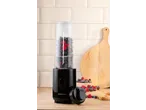 Liquidificador de smoothies SILVERCREST com bagas numa bancada de madeira.