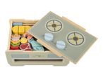 Wooden toy kitchen with play food, including vegetables, meat, and fish