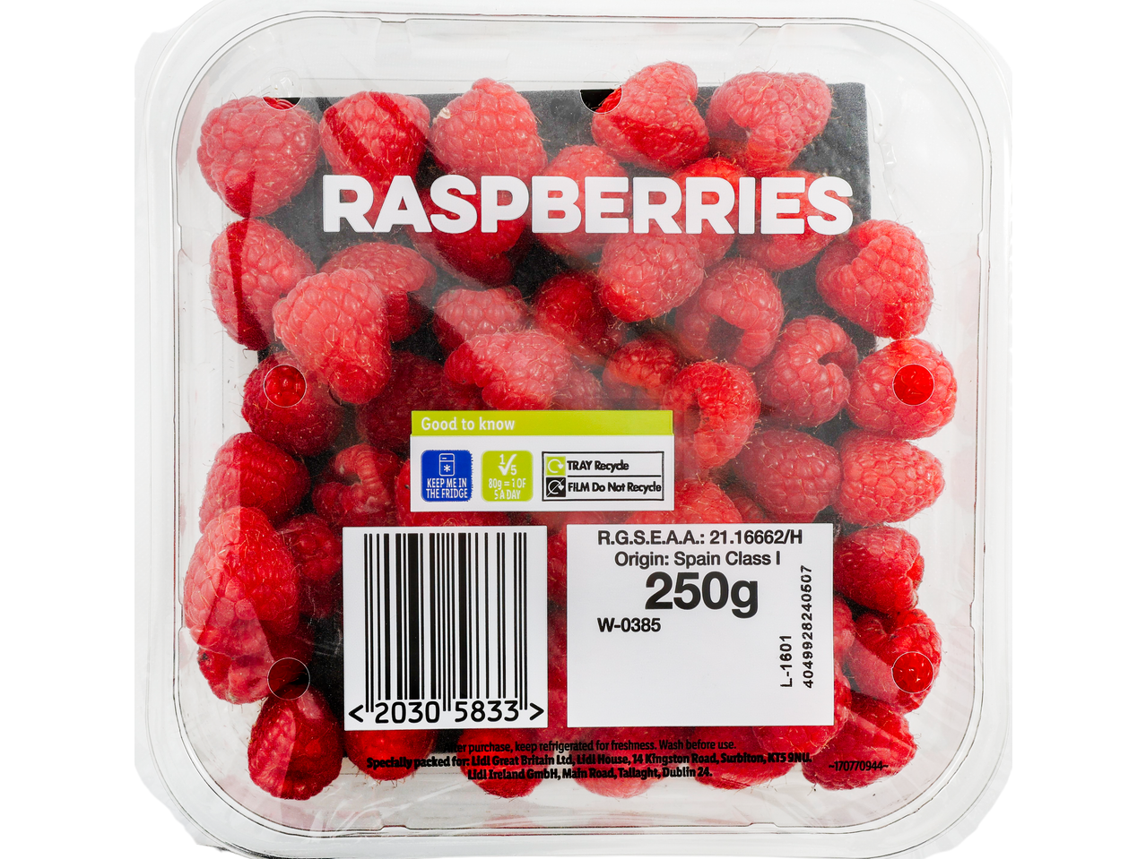 A clear plastic container of fresh red raspberries with a white and green label.