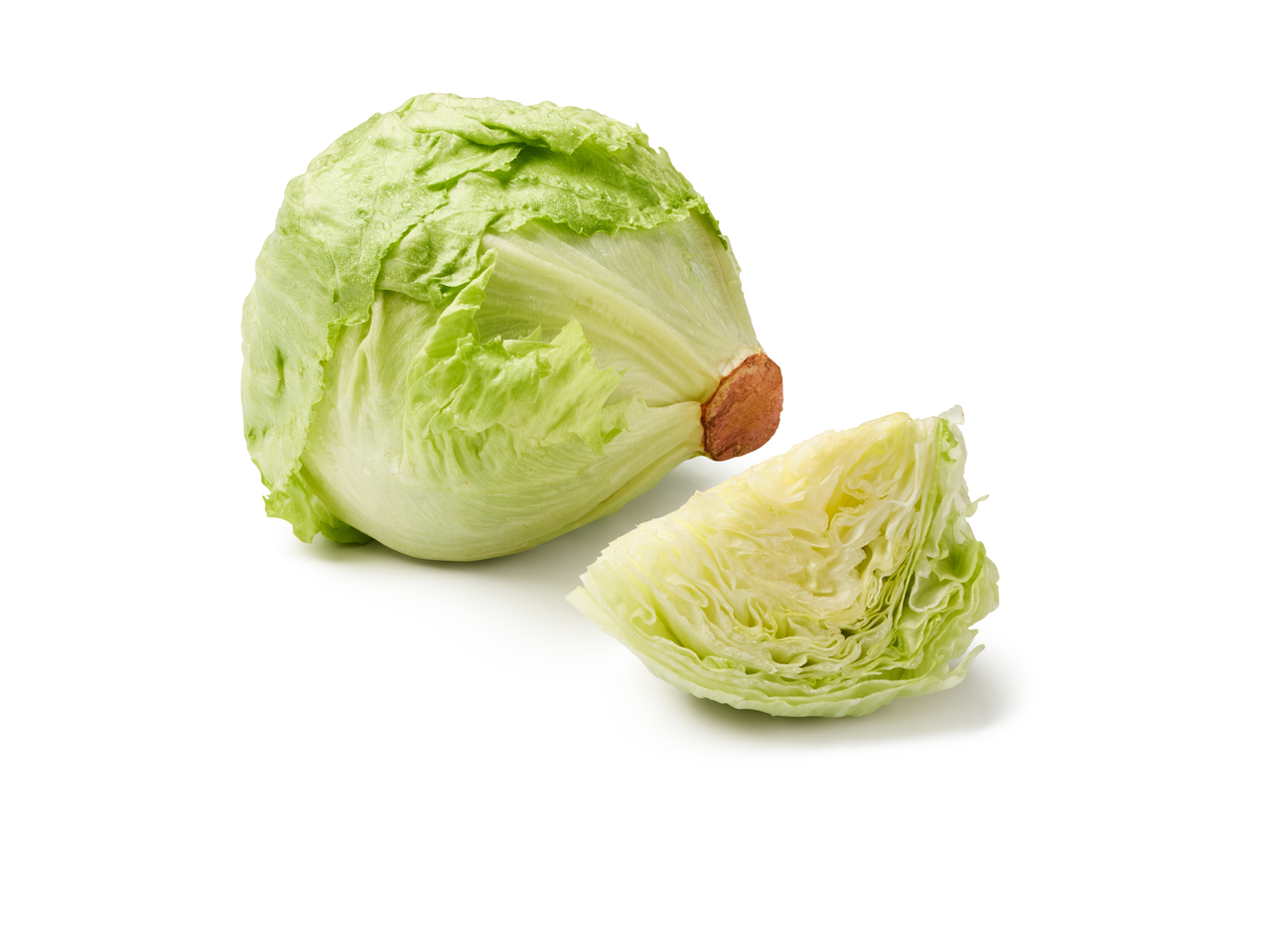 Whole and cut iceberg lettuce on a white background
