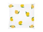 White pillow with a pattern of yellow lemons and green leaves.