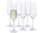 Sept flûtes à champagne, dont une remplie de vin mousseux.