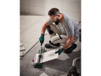 Tiler using a tile cutter to cut tiles.