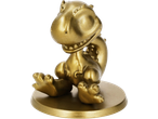 Estatueta dourada de um dinossauro de desenho animado sentado numa base redonda.