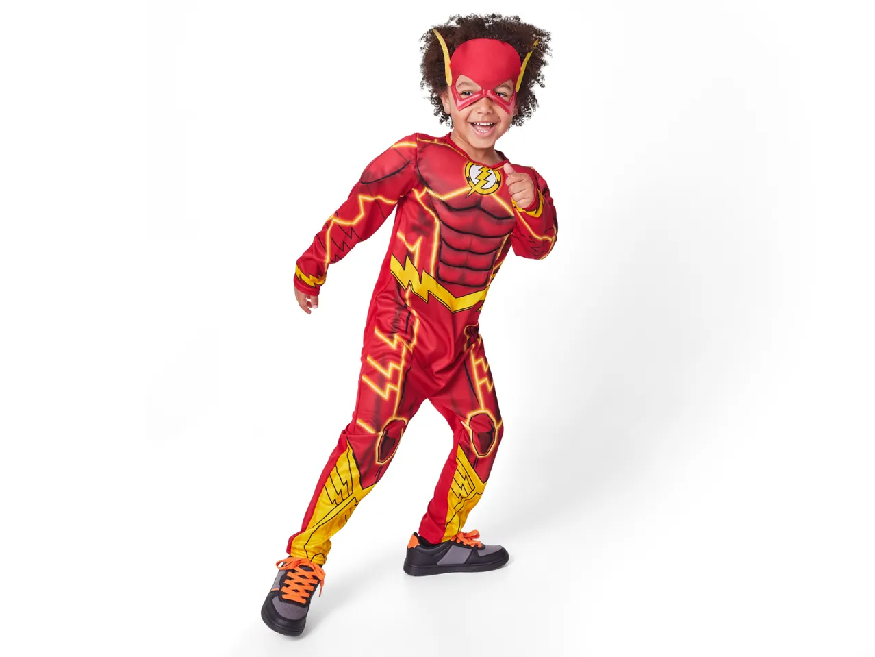 A young boy in a red Flash costume with a mask and sneakers.