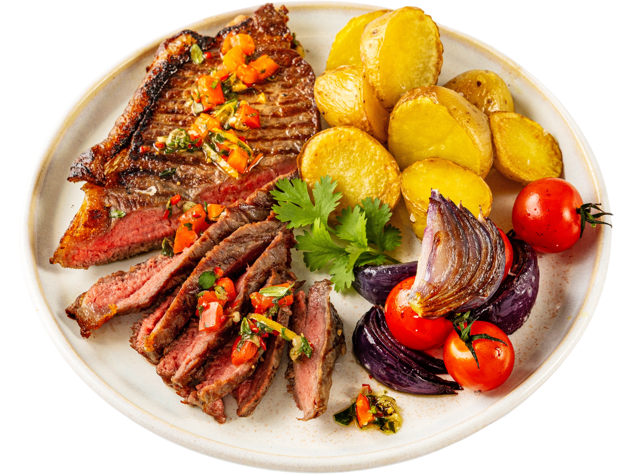 Grilled striploin steak with potatoes, tomatoes, and red onion.