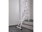 Multi-purpose ladder set up on stairs, with green safety straps and feet.