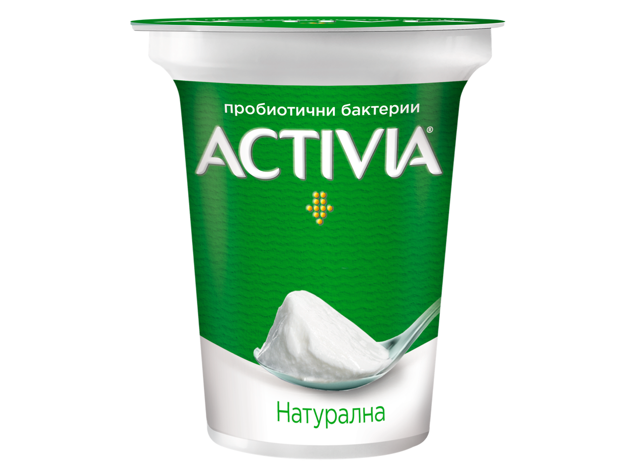 Зелена кофичка с кисело мляко с лъжица, пълна с бяло кисело мляко.
