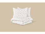 White duvet cover and two pillows with a small floral pattern