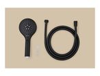 Black shower head and hose set with three white washers on a beige background.