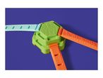 Green hexagonal toy with three colorful straps on a purple background.