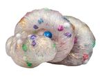 A translucent, spiral-shaped toy with embedded colorful confetti and a blue center bead.