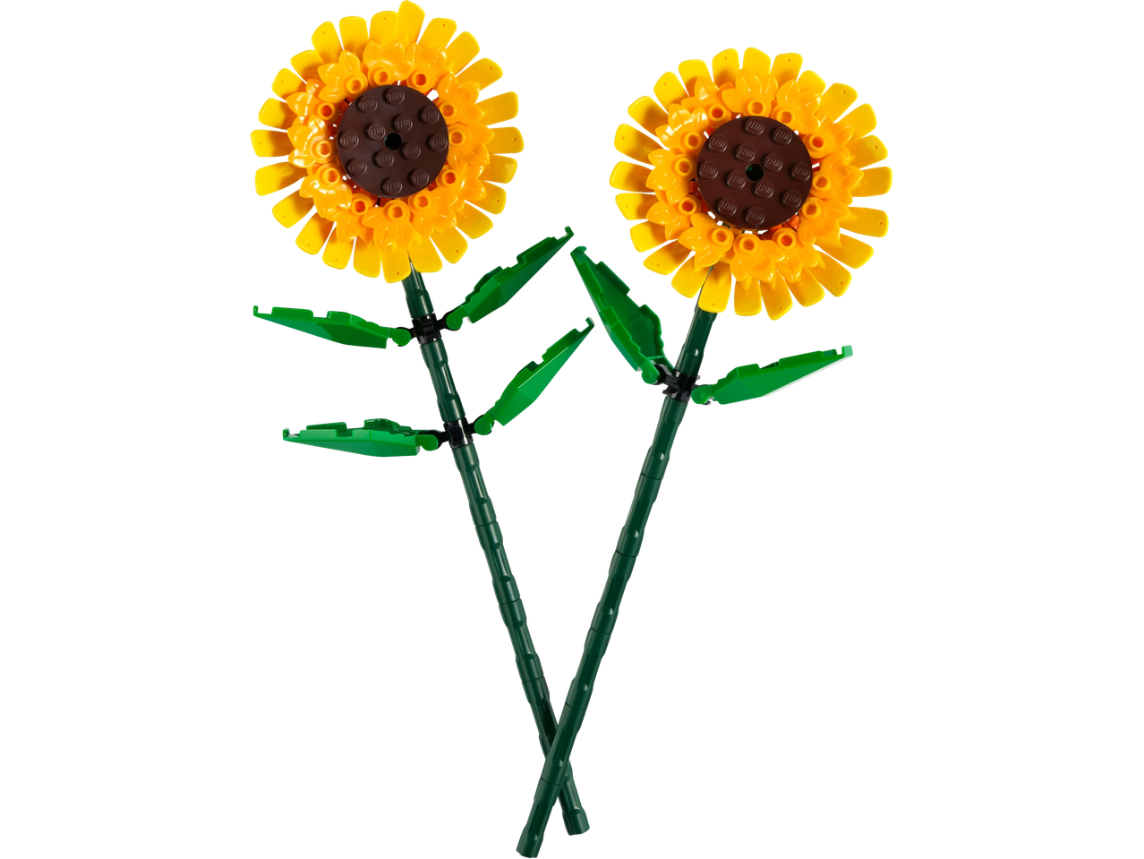 Dva žuta igračka suncokreta sa zelenim stabljikama i listovima, napravljena od kockica.