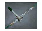 A green-handled cable puller with a steel cable and hooks on a dark background.