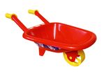 Red toy wheelbarrow with yellow handles and wheel, featuring cartoon superhero decals.