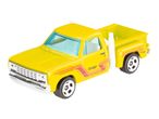 A yellow Hot Wheels Dodge pickup truck toy car.