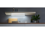 Plates, spice shelf, and LED under-cabinet lighting in kitchen.