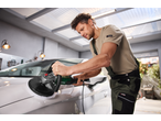 Man polishing a white car with a PARKSIDE® 1200W Electric Polisher in a garage.