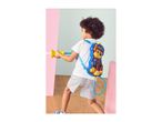 Child playing with a backpack water blaster, aiming a stream of water.