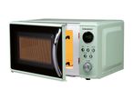 A retro-style SilverCrest microwave oven in light green with its door open.