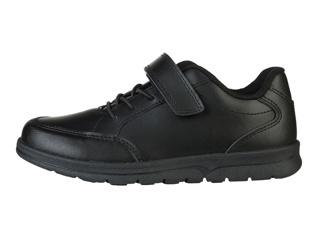 A black children's school shoe with a velcro strap.