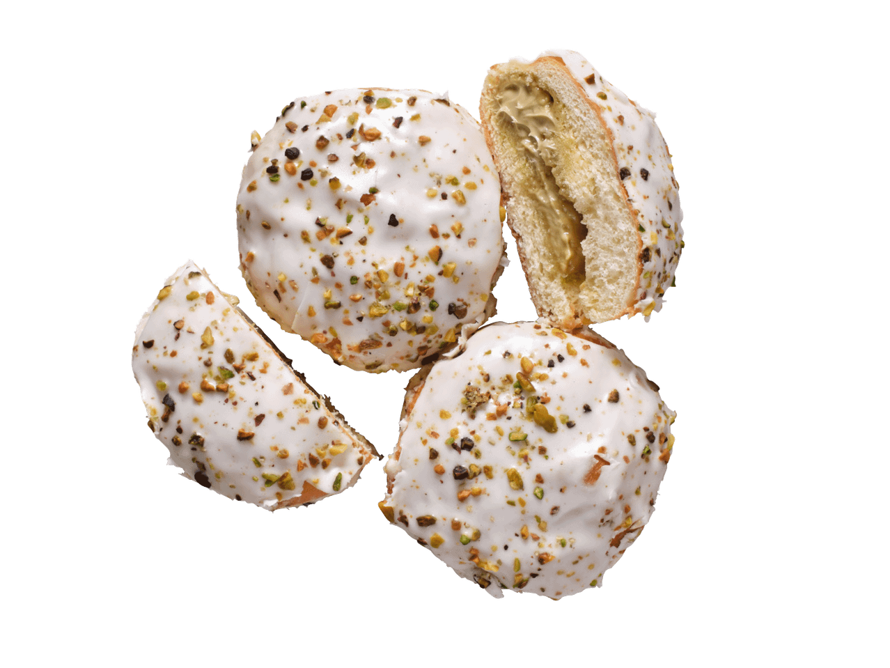 Valge glasuuriga ja pistaatsiapähklitega sõõrikud, üks on kreemja täidisega pooleks lõigatud.