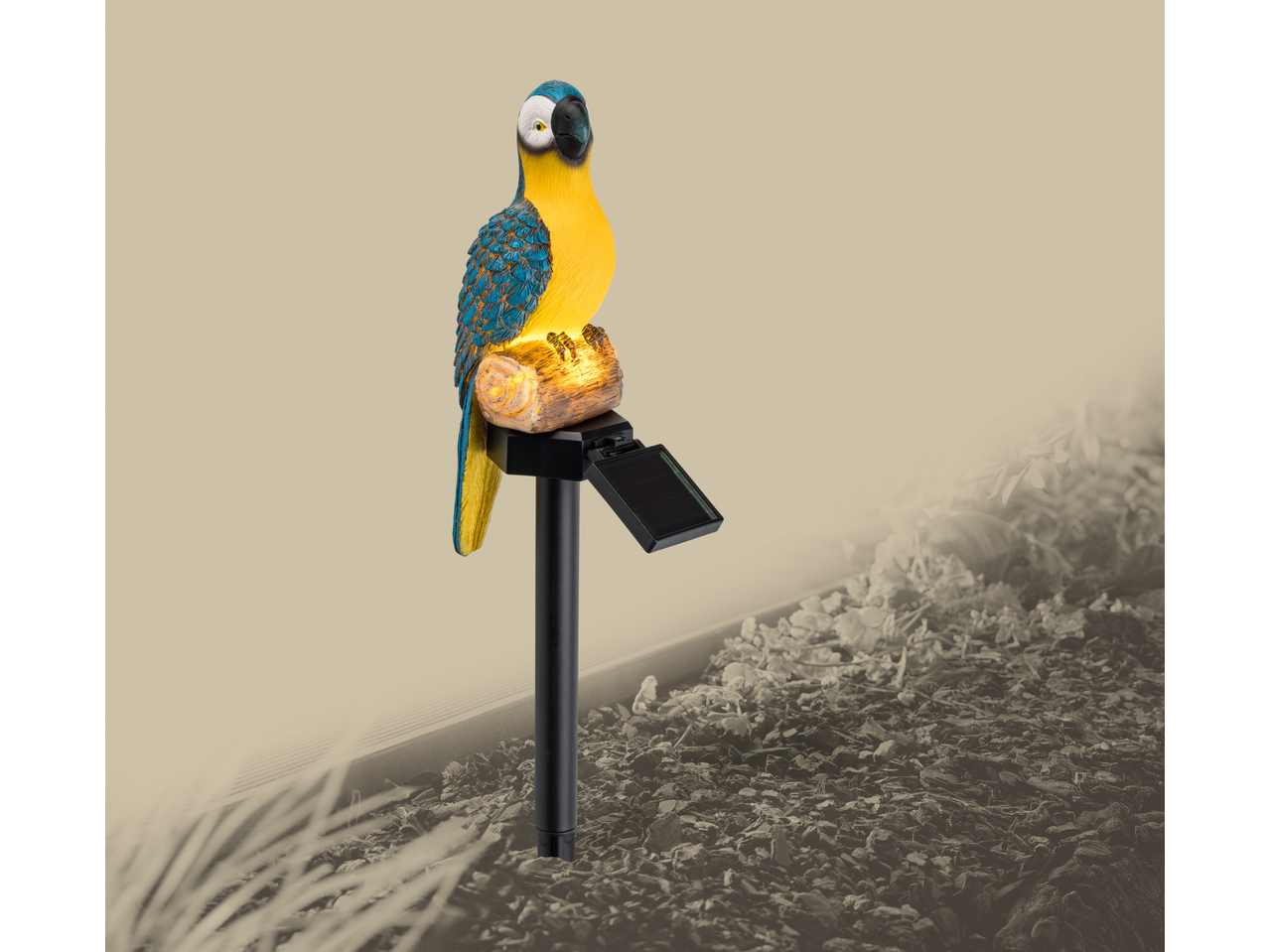 Solar-powered garden stake light in the shape of a blue and yellow parrot on a log.