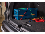 ULTIMATE SPEED® Bungee Cord Set securing a blue toolbox in a car trunk.