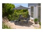 Outdoor dining set with a grey table, four chairs, and a cantilever parasol on a patio.