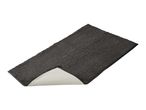 A dark gray bath mat with a textured surface and a visible non-slip backing.