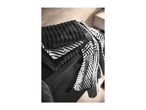 Black and white patterned towels on a dark cabinet.