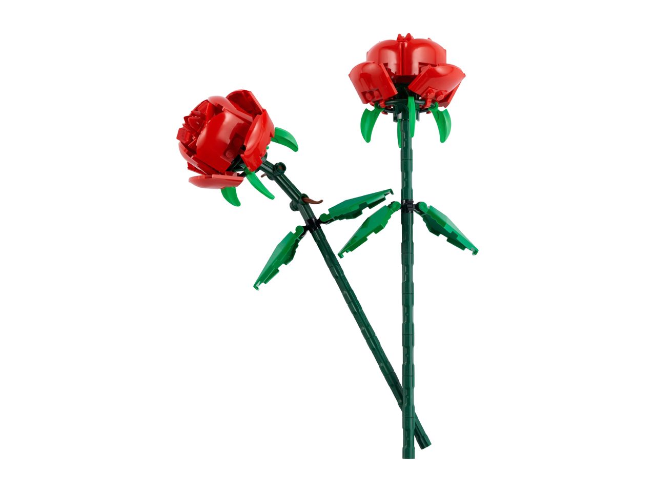 Two red roses made from building blocks, with green stems and leaves, on a white background.