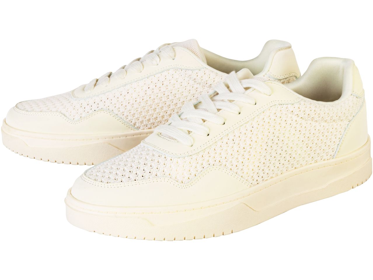 Pair of off-white knitted sneakers with thick soles.