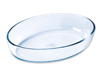 Eine ovale Pyrex-Glasschale auf schwarzem Hintergrund.