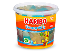 Een grote pot met kleurrijke vegetarische fruitgums in verschillende vormen, waaronder sterren en flessen.