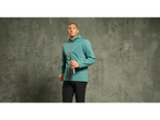 Man in a teal Crivit thermal softshell jacket holding a water bottle.