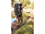 Hiker with a large CRIVIT backpack outdoors.