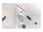 Window vacuum cleaner hanging on a glass shower door in a modern bathroom.