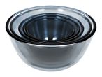 Set of four nesting glass mixing bowls with dark rims, viewed from above.