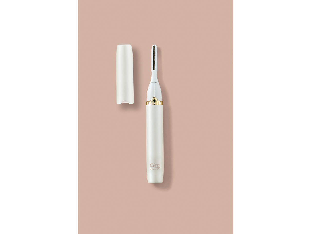 Cien BEAUTY Precision Trimmer, white with gold accents, and its cap on a light brown background.