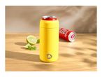 Yellow can cooler with a red soda can, lime, and mint on a wooden table.