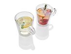 Two clear glass mugs with handles, one containing lemon tea and the other a fruit-infused beverage.