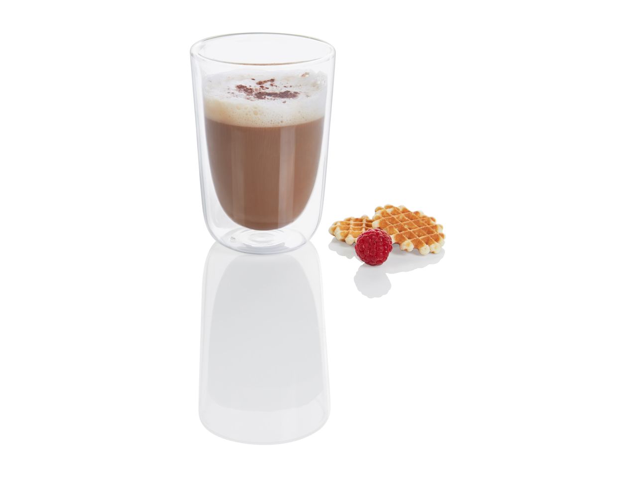 A double-walled glass holds a hot chocolate next to some pastries.