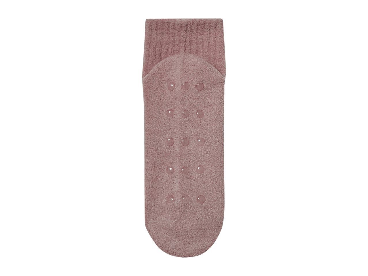 Pink anti-slip socks with grip dots on the sole.