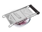 Stainless steel mandoline slicer with red onion slices in a glass bowl.