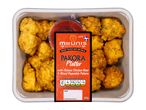 Pakora platter with Chinese chicken bites and mixed vegetable pakora, with a dipping sauce.