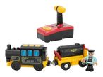 A remote control train set with a black and yellow train, a separate train car, and a conductor figure.