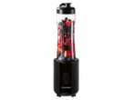 A SilverCrest personal blender filled with mixed berries sits on a black background.